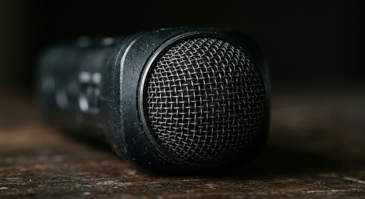 Close-up microphone grille representing audio recording laws